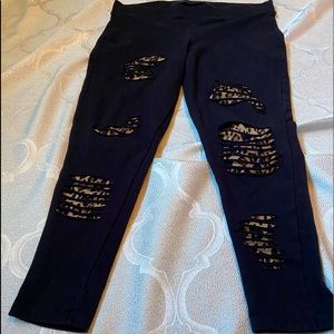 Torrid black premium legging knee slashed leopard print. Size 2.